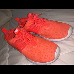 Orange Nike shoes